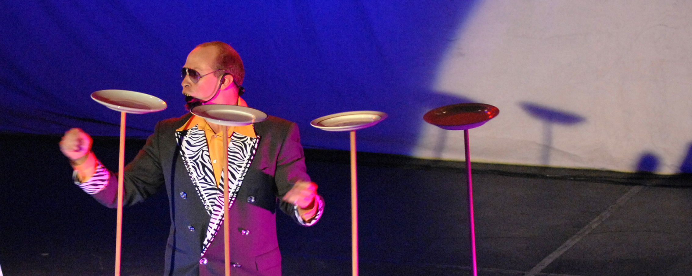 Kim Potter as Vinyl Burns spins the plates.