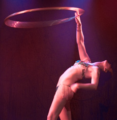 The Magenta Diamond in her Hula Hoop act in Heavenly Burlesque]. 